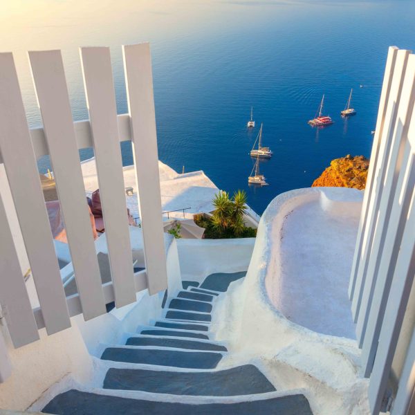 Amazing,Gate,To,Heaven.,Santorini,,Greece.,White,Architecture,,Open,Doors Amazing Gate to heaven. Santorini, Greece. White architecture, open doors and steps to the blue sea of Santorini. Holidays in Greece, Santorini.